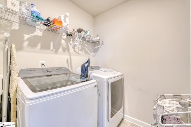 laundry room with separate washer and dryer