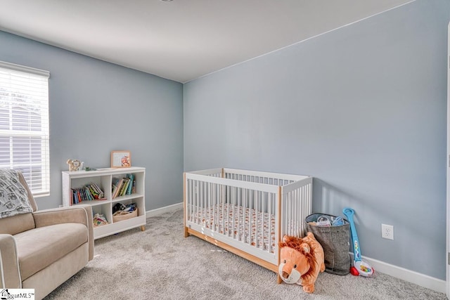 carpeted bedroom with a crib