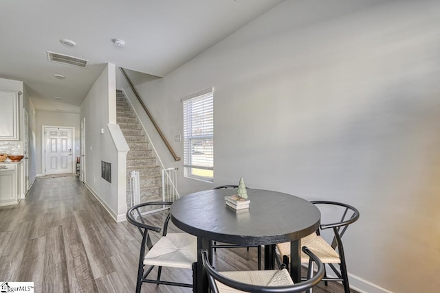 dining space with light wood-type flooring