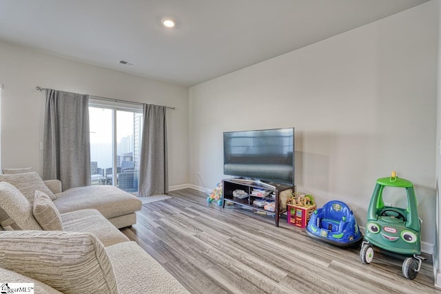 living room with light hardwood / wood-style floors