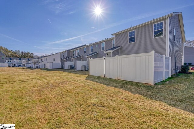 view of yard with central AC