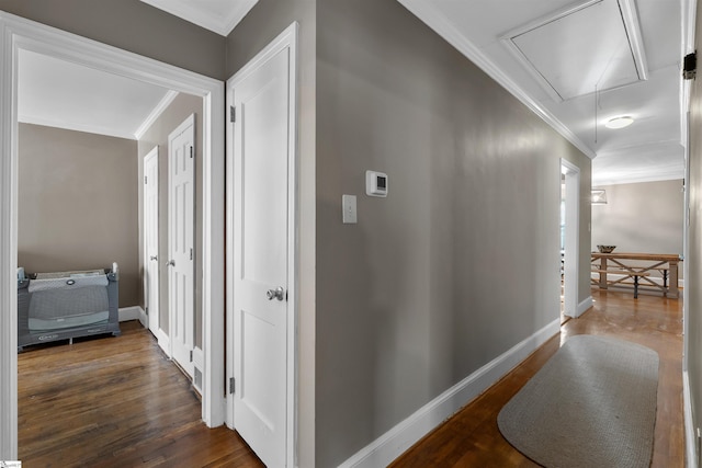 hall featuring crown molding and dark wood-type flooring