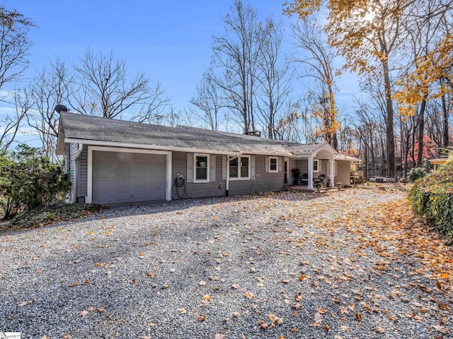 single story home with a garage