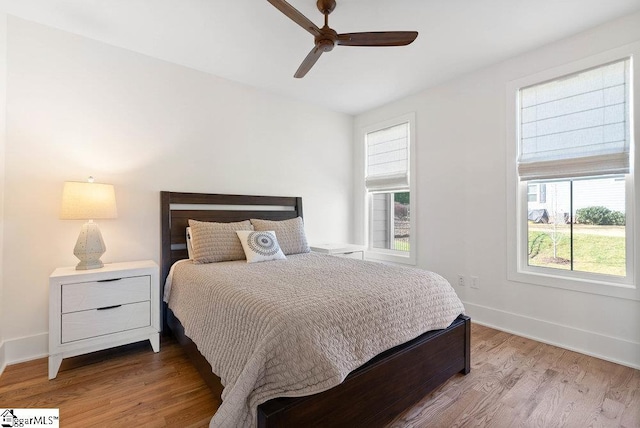 bedroom featuring ceiling fan and wood-type flooring