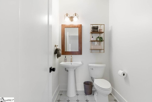 bathroom featuring toilet