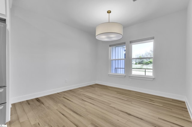 unfurnished room featuring light hardwood / wood-style floors