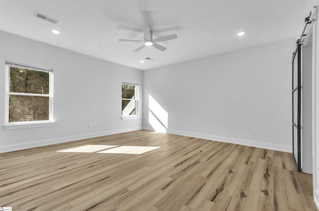 empty room featuring light hardwood / wood-style flooring and ceiling fan