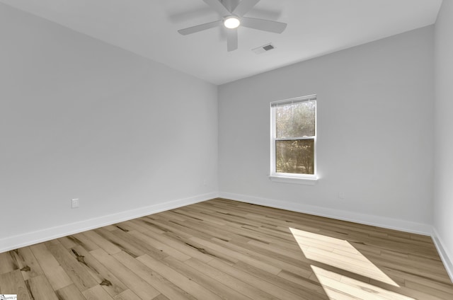 spare room featuring ceiling fan and light wood-type flooring