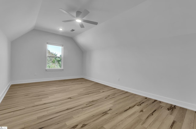 additional living space with light wood-type flooring, ceiling fan, and lofted ceiling