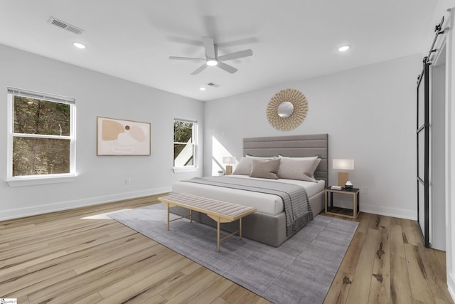 bedroom featuring light hardwood / wood-style flooring and ceiling fan