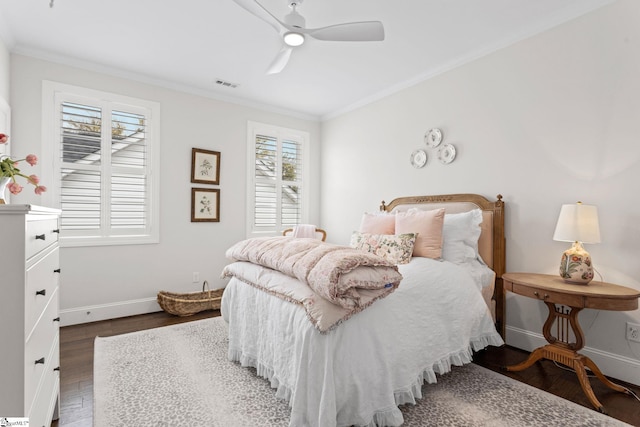 bedroom featuring ceiling fan, dark hardwood / wood-style floors, crown molding, and multiple windows