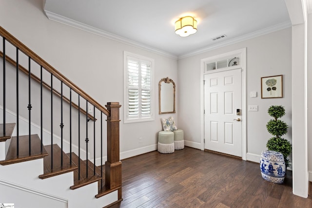 foyer featuring dark hardwood / wood-style floors and ornamental molding