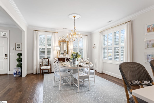 dining space with ornamental molding, dark hardwood / wood-style floors, a healthy amount of sunlight, and a notable chandelier