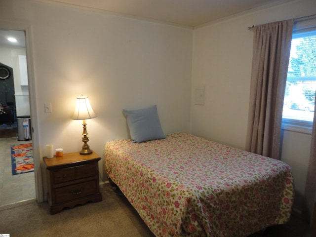 bedroom featuring carpet flooring and ornamental molding