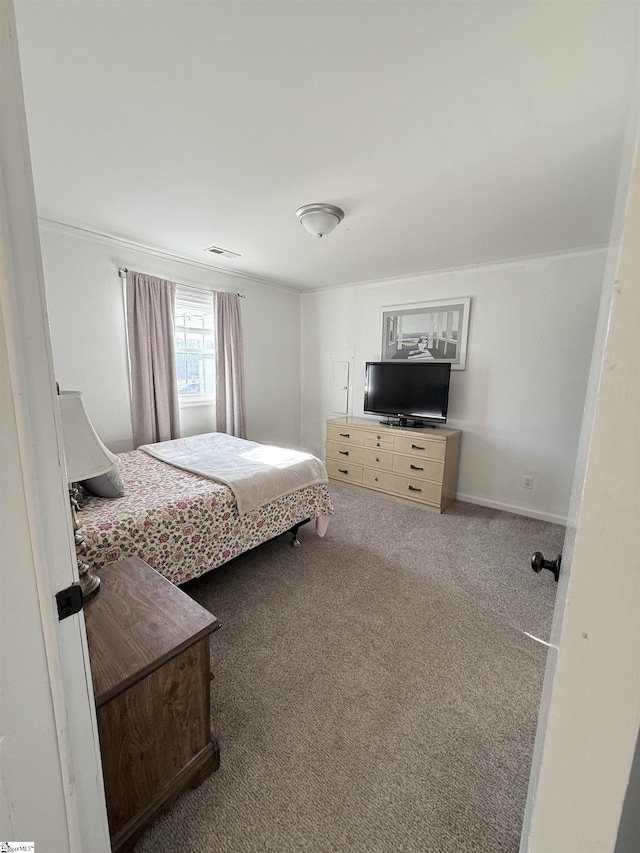 carpeted bedroom featuring ornamental molding