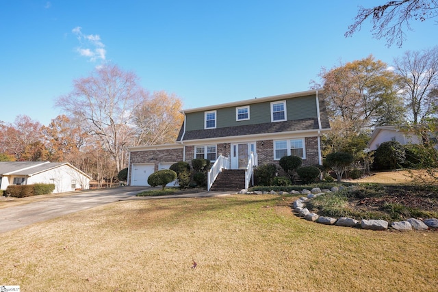 view of front property with a garage and a front lawn