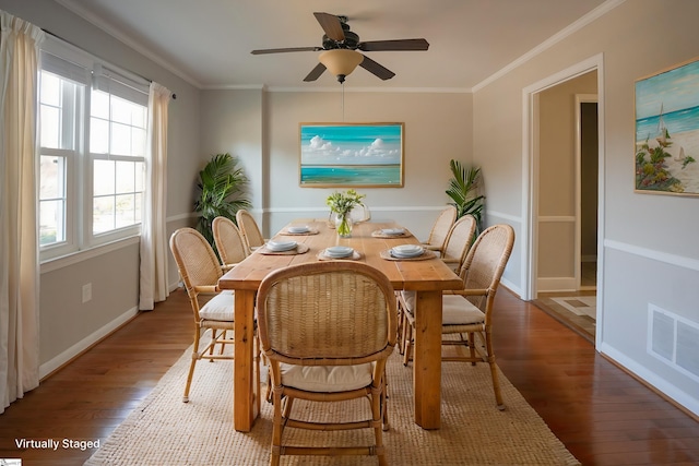 dining area with wood-type flooring, ceiling fan, and ornamental molding