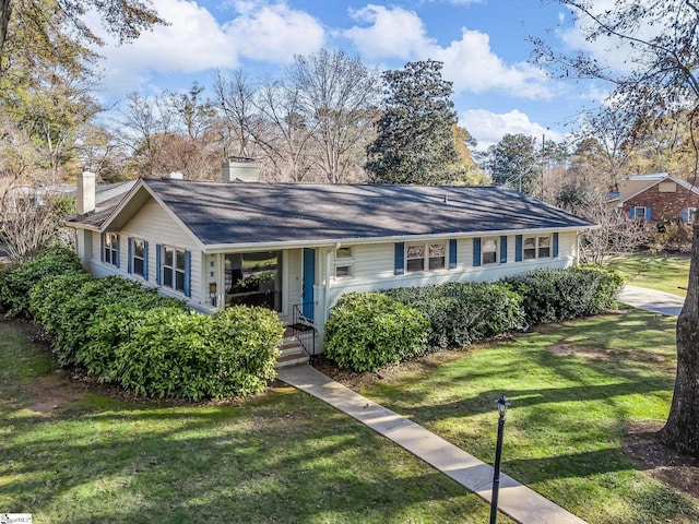 ranch-style house with a front yard