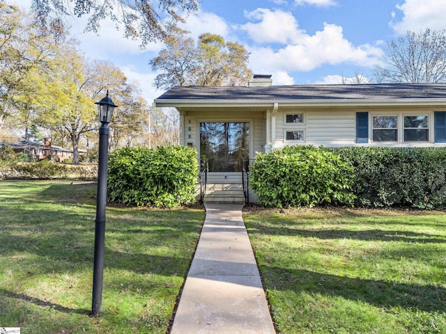 view of front of property with a front lawn