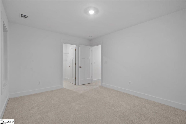 unfurnished bedroom with light carpet