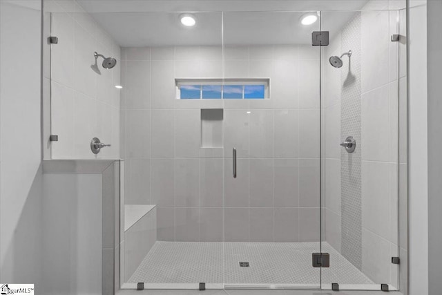 bathroom featuring an enclosed shower