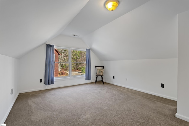 bonus room with carpet flooring and lofted ceiling