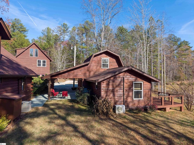 view of property exterior with a lawn, ac unit, a patio area, and a deck