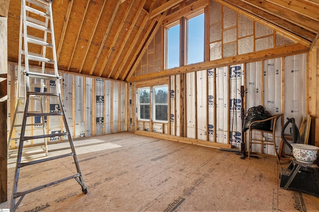 miscellaneous room with a wealth of natural light and high vaulted ceiling