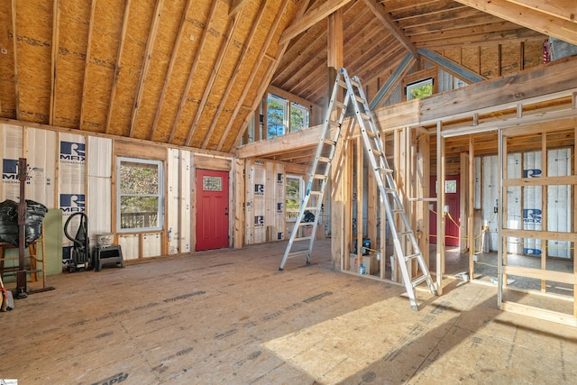 miscellaneous room with high vaulted ceiling