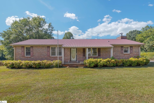 single story home with a front lawn