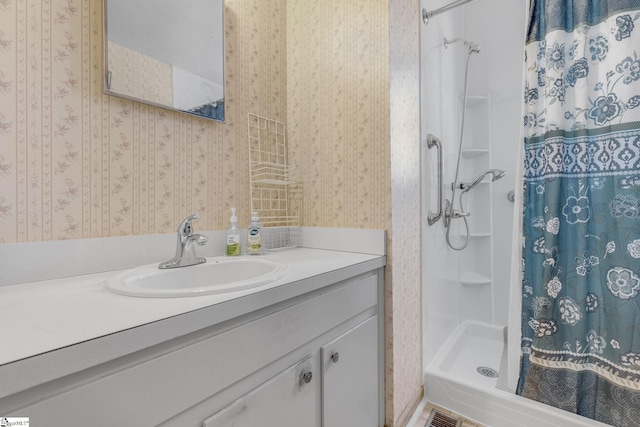 bathroom with a shower with curtain and vanity