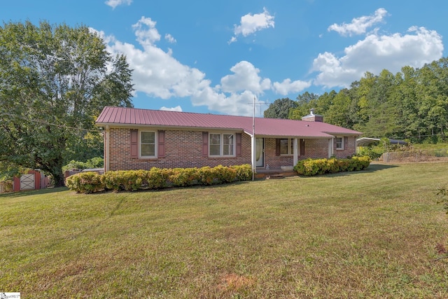 single story home featuring a front yard