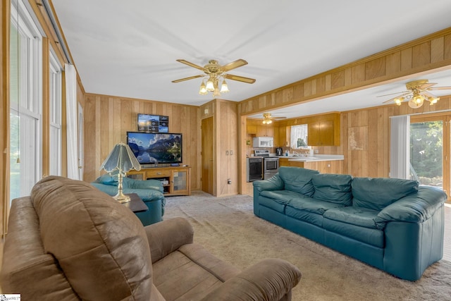 carpeted living room with wooden walls