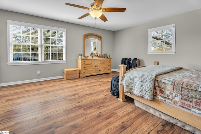 bedroom featuring hardwood / wood-style floors and ceiling fan