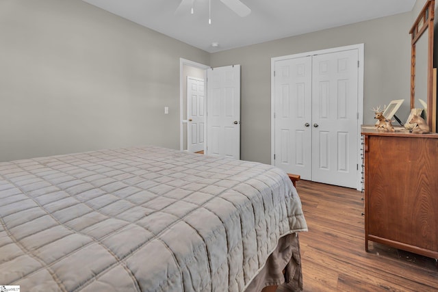 bedroom with wood-type flooring and ceiling fan