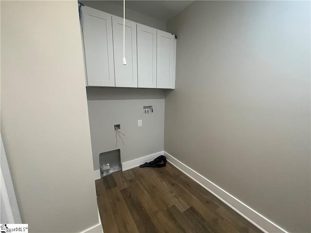 clothes washing area featuring washer hookup, dark hardwood / wood-style flooring, and cabinets