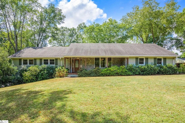 ranch-style house featuring a porch and a front yard