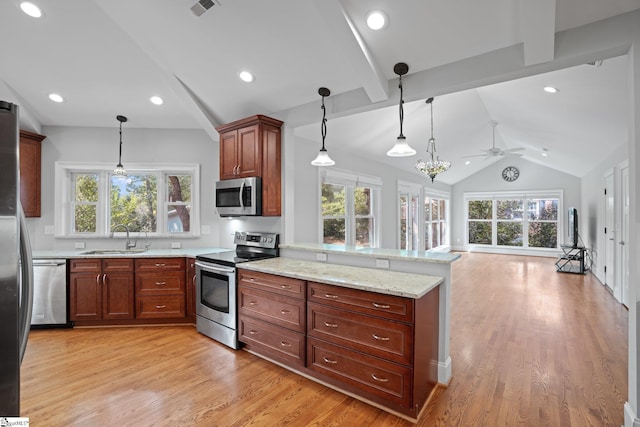 kitchen featuring sink, vaulted ceiling with beams, light wood-type flooring, kitchen peninsula, and stainless steel appliances