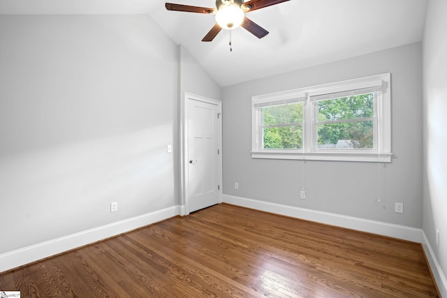 unfurnished room featuring ceiling fan, lofted ceiling, and hardwood / wood-style flooring