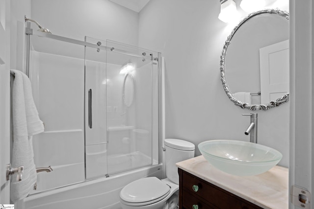 full bathroom with toilet, vanity, and combined bath / shower with glass door