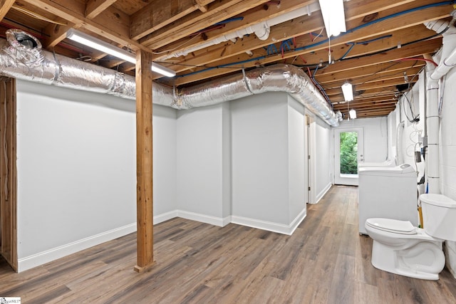 basement with hardwood / wood-style floors