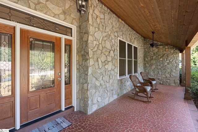 view of exterior entry with covered porch