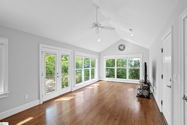 unfurnished living room featuring ceiling fan, french doors, dark hardwood / wood-style floors, and lofted ceiling