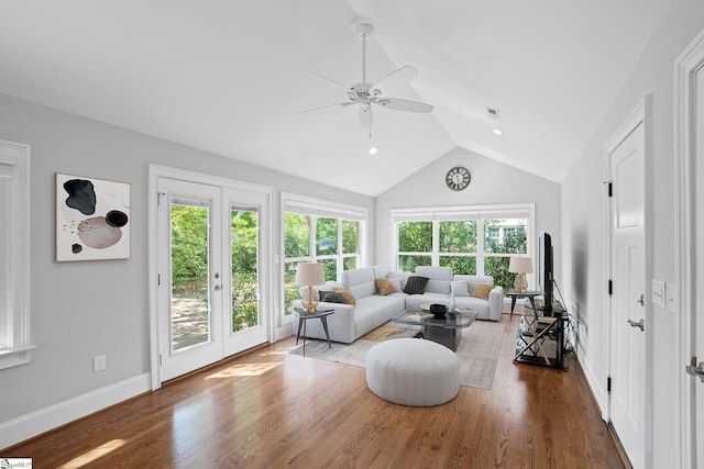 living room with ceiling fan, french doors, lofted ceiling, and hardwood / wood-style flooring