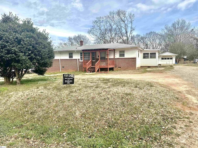 ranch-style home featuring a chimney, crawl space, fence, driveway, and a front lawn