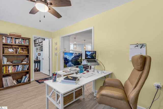 office space featuring light hardwood / wood-style floors and ceiling fan