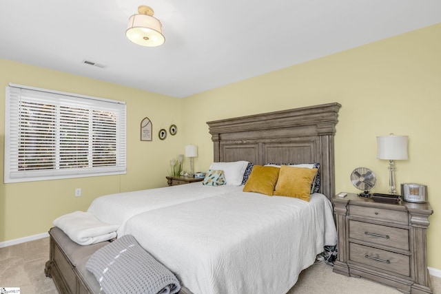 bedroom featuring light carpet