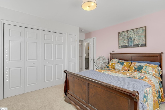 bedroom with light colored carpet and a closet