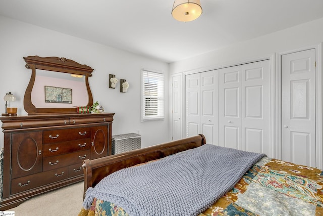 carpeted bedroom featuring a closet