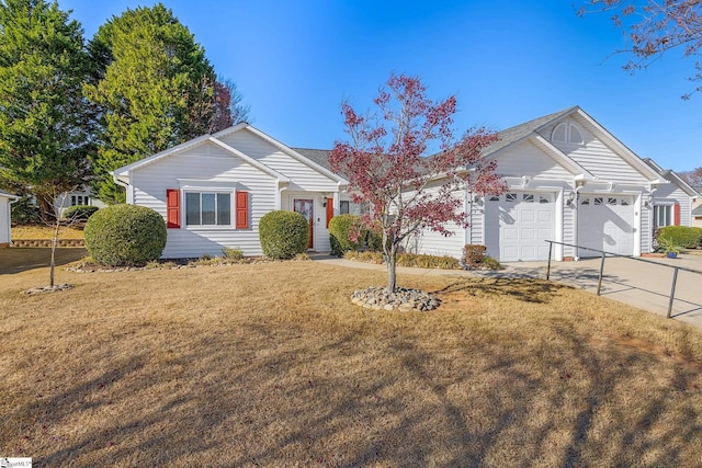 ranch-style home with a garage and a front lawn